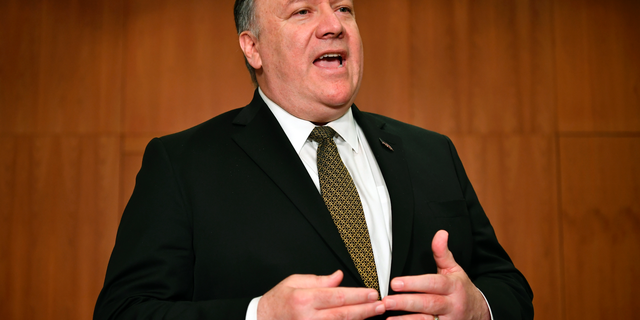 Secretary of State Mike Pompeo talks to the media on the sidelines of the Arctic Council ministers' working dinner at the Arktikum museum in Rovaniemi, Finland, Monday, May 6, 2019. The U.S. is dispatching an aircraft carrier and other military resources to the Middle East following what it says are indications that Iran and its proxy forces are preparing to possibly attack U.S. forces in the region. (Mandel Ngan/Pool Photo via AP)