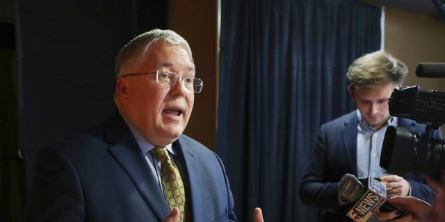 FILE - In this Nov. 1, 2018, file photo, Patrick Morrisey speaks to reporters after a debate in Morgantown, W.Va. (AP Photo/Raymond Thompson, File)