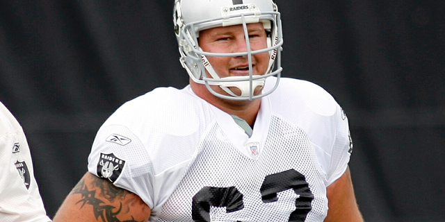 FILE - This July 28, 2007, file photo shows then Oakland Raiders center, Jeremy Newberry during workouts at the team's training camp in Napa, Calif. Newberry says, Sunday, May 19, 2019, vandals have destroyed nearly half of the 4,000 cherry trees recently planted at his Northern California orchard. (AP Photo/Dino Vournas, File)
