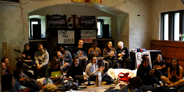 FILE - In this April 29, 2019 file photo Swarthmore College students sing during a sit-in at the Phi Psi fraternity house in Swarthmore, Pa. Students at the suburban Philadelphia college have occupied the on-campus fraternity house in an effort to get it shut down after documents allegedly belonging to Phi Psi surfaced containing derogatory comments about women and the LGBTQ community and jokes about sexual assault. School President Valerie Smith announced Friday, May 10, 2019 that fraternities and sororities will no longer be allowed at Swarthmore College. (AP Photo)