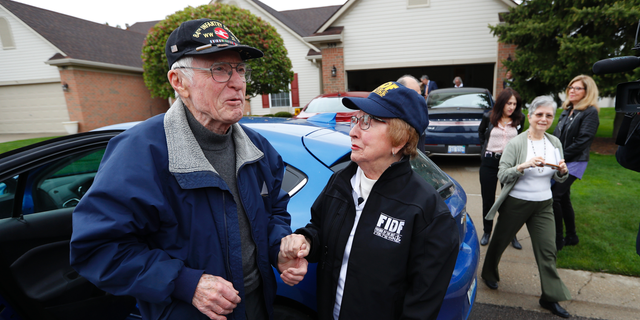 Doug Harvey, 95, and holocaust survivor Sophie Tajch Klisman, 89, right, greet each other in Commerce Township, Mich., Monday, May 13, 2019. Harvey, was a US Army soldier in the 84th Infantry Division, which helped liberate the Salzwedel concentration camp in Nazi Germany and free its captives including Klisman. (AP Photo/Paul Sancya)