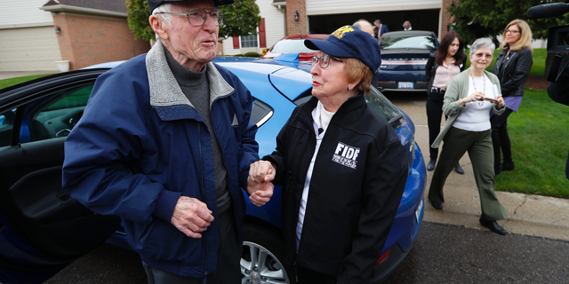 Doug Harvey, 95, and holocaust survivor Sophie Tajch Klisman, 89, right, greet each other in Commerce Township, Mich., Monday, May 13, 2019. Harvey, was a US Army soldier in the 84th Infantry Division, which helped liberate the Salzwedel concentration camp in Nazi Germany and free its captives including Klisman. (AP Photo/Paul Sancya)
