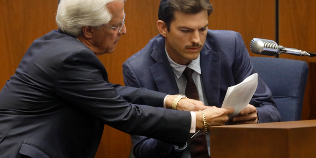 Defense Attorney Daniel Nardoni, left, questions Ashton Kutcher during his tesitimony in the murder trial of Michael Gargiulo in Los Angeles Superior Court, Wednesday, May 29, 2019. Gargiulo, 43, has pleaded not guilty to two counts of murder and an attempted-murder charge stemming from attacks in the Los Angeles area between 2001 and 2008, including the death of Kutcher's former girlfriend, 22-year-old Ashley Ellerin.