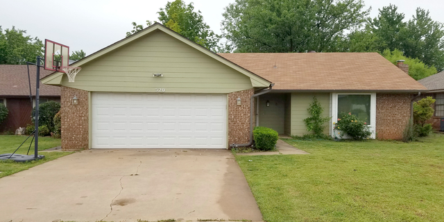 This May 1, 2019 photo shows the Edmond, Okla. home where police say a naked 17-year-old high school student, Isaiah Mark Lewis, was fatally shot Monday, after forcing his way inside. Police in the Oklahoma City suburb say two officers, Sgt. Milo Box and Officer Denton Scherman were not wearing body cameras when at least one of them fatally shot the unarmed teenager. Box has worked at the department for 17 years, and Scherman was hired in September. (AP Photo/Ken Miller)