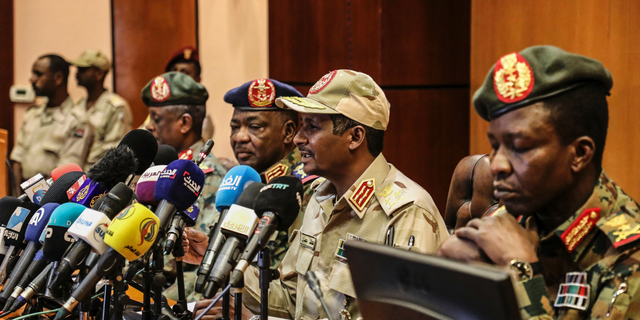 FILE - In this April 30, 2019 file photo, Gen. Mohamed Hamdan Dagalo, the deputy head of the military council, second right, speaks at a press conference in Khartoum, Sudan. As the uprising against Sudanese President Omar al-Bashir gained strength, Egypt, the United Arab Emirates and Saudi Arabia began reaching out to the military through secret channels to encourage his removal from power. (AP Photo)
