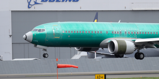FILE - In this April 10, 2019, file photo a Boeing 737 MAX 8 airplane being built for India-based Jet Airways lands following a test flight at Boeing Field in Seattle. The grounding of Boeing 737 Max jets likely means that fare increases this summer will be larger than already expected and airlines will struggle to handle disruptions such as storms that shut down hub airports. (AP Photo/Ted S. Warren, File)