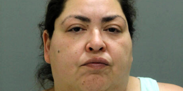 This booking photo provided by the Chicago Police Department, Thursday, May 16, 2019, shows Clarisa Figueroa, who is charged in the death of 19-year-old expectant mother Marlen Ochoa-Lopez. First-degree murder charges have been filed against Figueroa and her daughter Desiree Figueroa in connection with the death of Ochoa-Lopez, whose body was discovered earlier in the week, strangled before her baby was cut from her womb. (Chicago Police Department via AP)