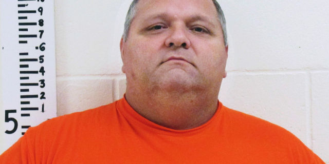 FILE - This undated booking photo released by the York County Sheriff's Department shows Michael Middleton, accused of marrying women in multiple states including New Hampshire. Middleton, who avoided jail time on bigamy charges could end up behind bars after all after authorities say he lied about his whereabouts and then disappeared. Middleton pleaded guilty last month and was given a 12-month suspended sentence. A warrant was issued for his arrest Wednesday, May 8, 2019, after a probation officer said Middleton was missing. (York County Sheriff's Department via AP, File)