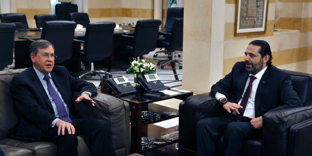 U.S. Deputy Assistant Secretary of State David Satterfield, left, speaks during his meeting with Lebanese Prime Minister Saad Hariri, in Beirut, Lebanon, Tuesday, May 14, 2019. Satterfield's visit comes a week after President Michel Aoun presented the U.S. ambassador to Lebanon with a "unified stance" regarding the demarcation of maritime border between Lebanon and Israel. (AP Photo/Bilal Hussein)