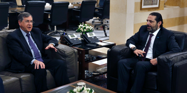 U.S. Deputy Assistant Secretary of State David Satterfield, left, speaks during his meeting with Lebanese Prime Minister Saad Hariri, in Beirut, Lebanon, Tuesday, May 14, 2019. Satterfield's visit comes a week after President Michel Aoun presented the U.S. ambassador to Lebanon with a "unified stance" regarding the demarcation of maritime border between Lebanon and Israel. (AP Photo/Bilal Hussein)