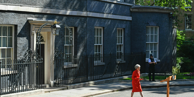Britain's Prime Minister Theresa May arrives to make a statement outside at 10 Downing Street in London, Friday May 24, 2019. Theresa May says she'll quit as UK Conservative leader on June 7, sparking contest for Britain's next prime minister. (Dominic Lipinski/PA via AP)