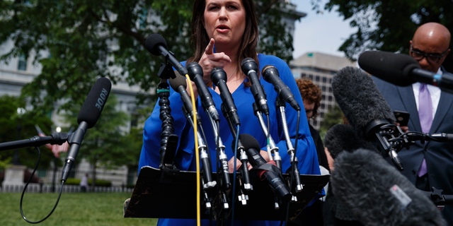 White House press secretary Sarah Sanders speaks with reporters outside the White House, Friday, May 3, 2019, in Washington. (AP Photo/Evan Vucci)