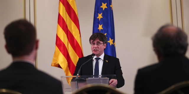 FILE - In this Feb. 18, 2019 file photo, Catalonia's former regional president. Carles Puigdemont, addresses a conference in Brussels. Spanish political party officials said on Monday, April 29, 2019, that Spain's Electoral Board has ruled that Puigdemont and two other Catalan separatists who fled abroad to escape arrest can’t stand as candidates in next month's European Parliament elections. (AP Photo/Francisco Seco, File)