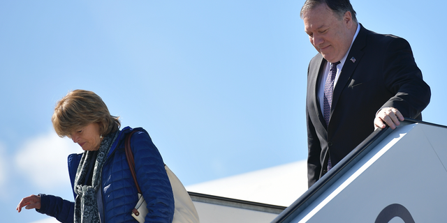 Secretary of State Mike Pompeo and Sen. Lisa Murkowski, R-Alaska, steps off a plane upon arrival in Rovaniemi, Finland, Monday, May 6, 2019. (Mandel Ngan/Pool Photo via AP)