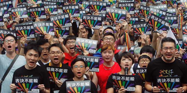 Same-sex marriage supporters gather outside the Legislative Yuan in Taipei, Taiwan, on Friday. (Associated Press)