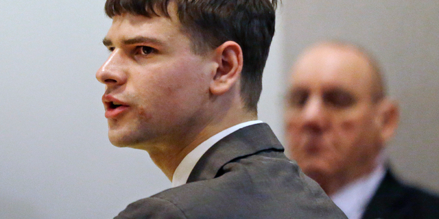 FILE - In this April 3, 2018 file photo, Nathan Carman, accused by family members of killing his millionaire grandfather and possibly his mother in an attempt to collect inheritance money, speaks during a probate hearing in district court in Concord, N.H. A New Hampshire judge released a ruling, Friday, May 10, 2019, saying Carman's late grandfather, John Chakalos, was not a state resident and that the New Hampshire probate court trial, scheduled for June 2019, had been cancelled. (AP Photo/Elise Amendola, Pool, File)