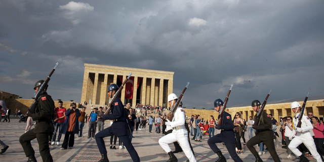 Soldiers march during a changing of guard ceremony as thousands of people visit the mausoleum of Mustafa Kemal Ataturk, the founder of modern Turkey, to pay respect on the day marking the 100th anniversary of the start of Turkey's War of Independence under the leadership of young Ottoman army general, Mustafa Kemal (Ataturk), 38, in Ankara, Turkey, Sunday, May 19, 2019.(AP Photo/Burhan Ozbilici)