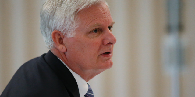 FILE - In this Thursday, May 9, 2019, file photo, University of Oklahoma President James L. Gallogly is pictured before a Board of Regents meeting in Norman, Okla. Gallogly, a former energy industry executive who came out of retirement to succeed David Boren as the university's president, said in a statement released Sunday, May 12, that he has advised the university's regents of his plans to retire once they have a transition plan in place. He took on the position last year. (AP Photo/Sue Ogrocki, File)