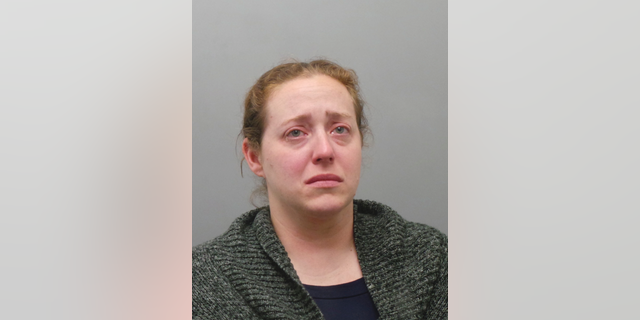 This undated photo provided by the St. Louis County Police Department shows Ladue, Mo., Police Officer Julia Crews, 37, who was charged Wednesday, May 1, 2019, with second-degree assault. Authorities say Crews meant to use a stun gun but accidently shot her service revolver during a confrontation with a shoplifting suspect outside a grocery store. The 33-year-old woman who was shot remains hospitalized. (St. Louis County Police via AP)
