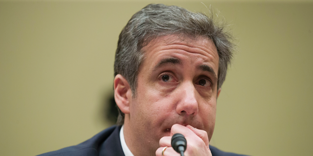FILE - In this Feb. 27, 2019, photo, President Donald Trump's former personal lawyer Michael Cohen listens to a question while testifying before the House Oversight and Reform Committee, on Capitol Hill, in Washington DC.  (AP Photo/Alex Brandon, File)
