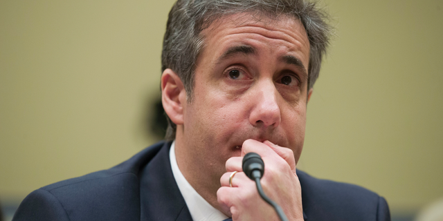 FILE - In this Feb. 27, 2019, photo, President Donald Trump's former personal lawyer Michael Cohen listens to a question while testifying before the House Oversight and Reform Committee, on Capitol Hill, in Washington DC.  (AP Photo/Alex Brandon, File)