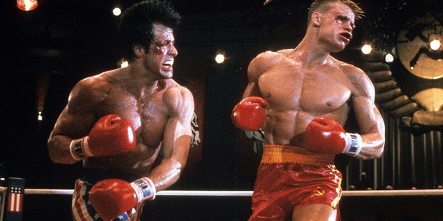 Sylvester Stallone punches Dolph Lundgren in a scene from the film 