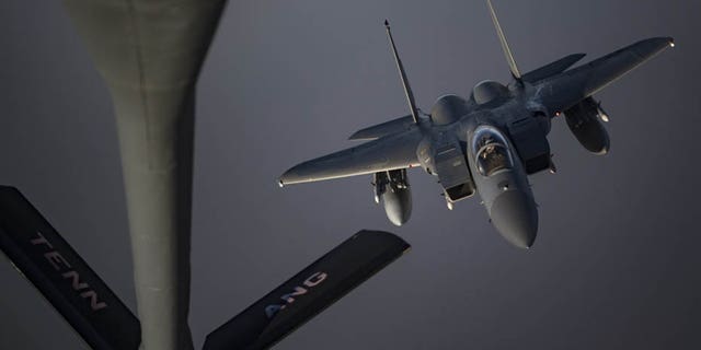 An F-15C Eagle prepares to receive fuel from a KC-135 Stratotanker from the 28th Expeditionary Aerial Refueling Squadron on Sunday at an undisclosed location.