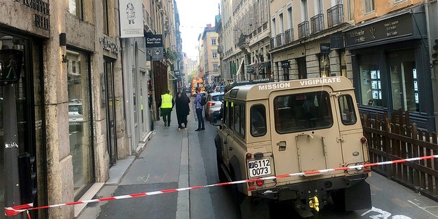 A vehicle belonging to French anti-terror investigators near the site of the attack in central Lyon on Friday.