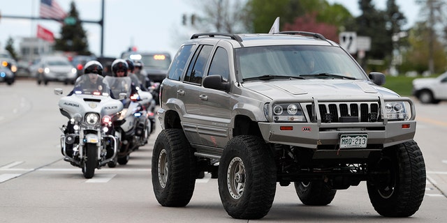More than 600 Jeeps lead a caravan to the memorial service for Kendrick Castillo, who was killed in the assault on the STEM School Highlands Ranch on Wednesday. (AP Photo/David Zalubowski)