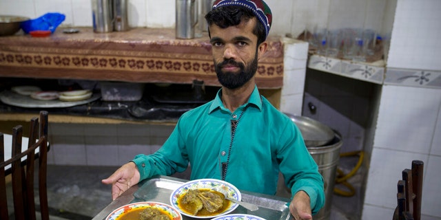 Rozi Khan, a 26-year-old Pakistani who shares a resemblance to the U.S. actor Peter Dinklage, works as a waiter in a small cafe in Rawalpindi, Pakistan.