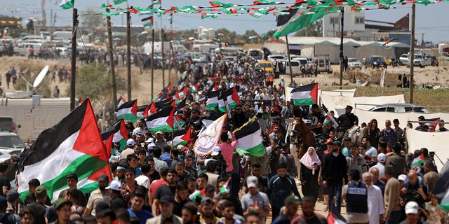 Palestinians attend a protest by the Israeli border with Gaza Strip, Wednesday, May 15, 2019.