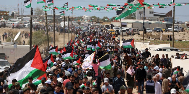 Palestinians attend a protest by the Israeli border with Gaza Strip, Wednesday, May 15, 2019.