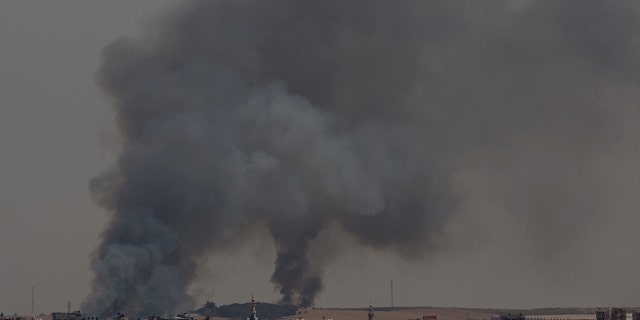 Smoke rises from fires on Israeli farmland caused by arson balloons launched from Gaza City, Wednesday, May 15, 2019.