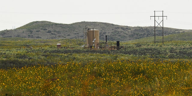 According to court documents, Shanann Watts' body was found in a shallow grave near this oil tank Aug. 21, 2018, near Roggen, Colorado. The bodies of both of her daughters -- 4-year-old Bella and 3-year-old Celeste -- were submerged for days in the same oil tanks in rural eastern Colorado, prosecutors said. 