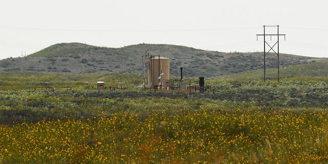 According to court documents, Shanann Watts' body was found in a shallow grave near this oil tank Aug. 21, 2018, near Roggen, Colorado. The bodies of both of her daughters -- 4-year-old Bella and 3-year-old Celeste -- were submerged for days in the same oil tanks in rural eastern Colorado, prosecutors said. 