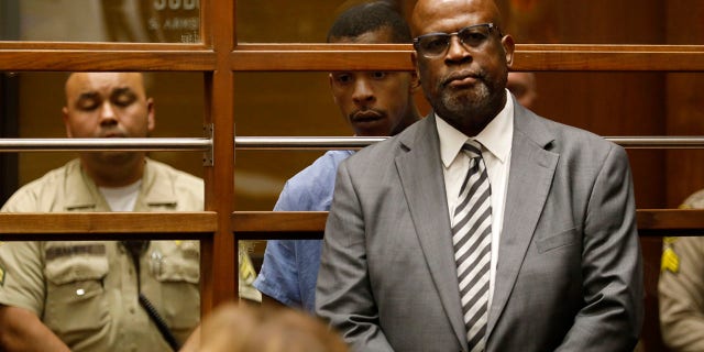 Chris Darden representing Eric Holder in court on April 4.