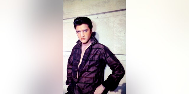 Singer Elvis Presley poses for a studio portrait. (Photo by Liaison)