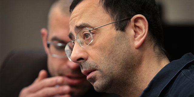 Larry Nassar appears in court to listen to victim impact statements during his sentencing hearing on January 17, 2018, in Lansing, Michigan. He was accused of molesting more than 100 girls while he was a physician for USA Gymnastics and Michigan State University.