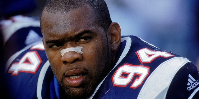 Greg Spires #94 of the New England Patriots looks on as he rests on the sidelines during the game against the Indianapolis Colts at the Foxboro Stadium in Foxboro, Mass., on Oct. 8, 2000. (Rick Stewart /Allsport)