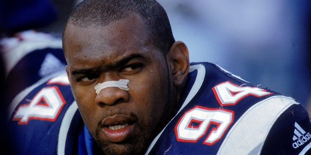 Greg Spires #94 of the New England Patriots looks on as he rests on the sidelines during the game against the Indianapolis Colts at the Foxboro Stadium in Foxboro, Mass., on Oct. 8, 2000. (Rick Stewart /Allsport)