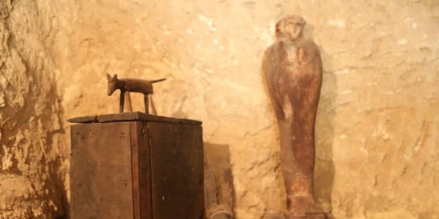 Archaeologists discovered a number of artifacts, including a statue.