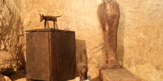 Archaeologists discovered a number of artifacts, including a statue.