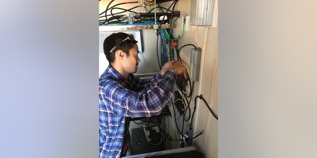 MuralNet Founder Brian Shih helping Niles Radio Communications as they install equipment on the Long Mesa Tower. (MuralNet)