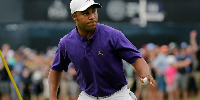 Harold Varner III reacts after sinking a putt for birdie on the first green during the final round of the PGA Championship golf tournament, Sunday, May 19, 2019, at Bethpage Black in Farmingdale, N.Y. (AP Photo/Seth Wenig)