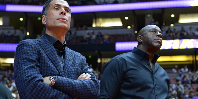Rob Pelinka, general manager of the Los Angeles Lakers talks to Earvin Magic Johnson, president of basketball operations of the Lakers before the game against the Minnesota Timberwolves on September 30, 2017 at the Honda Center in Anaheim, California. (Photo by Robert Laberge/Getty Images)