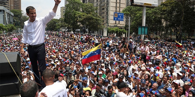 Opposition leader Juan Guaidó flashes a thumbs up at supporters during a rally in Caracas on Wednesday. (AP)