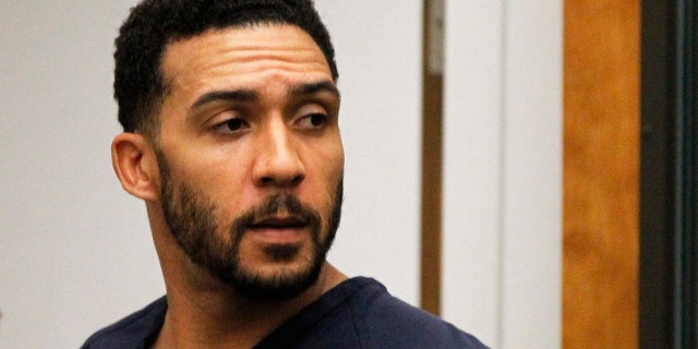 FILE - Former NFL football player Kellen Winslow Jr., center, leaves his arraignment in Vista, Calif. AP/Pool