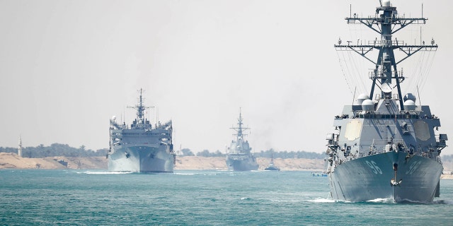 In this Thursday, May 9, 2019 photo released by the U.S. Navy, the Abraham Lincoln Carrier Strike Group transits the Suez Canal in Egypt. (Mass Communication Specialist 3rd Class Darion Chanelle Triplett/U.S. Navy via AP)