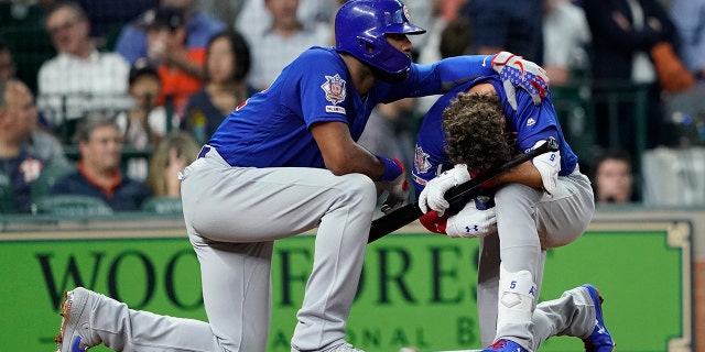Chicago Cubs' Albert Almora Jr., right, is comforted by Jason Heyward after hitting a foul ball into the stands during the fourth inning of a baseball game against the Houston Astros Wednesday, May 29, 2019, in Houston. (AP Photo/David J. Phillip)