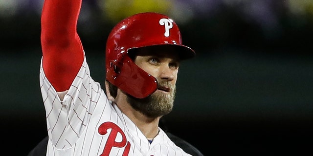 Bryce Harper of the Philadelphia Phillies gestures after hitting a double off of Washington Nationals pitcher Jeremy Hellikson on May 3, 2019 in Philadelphia.